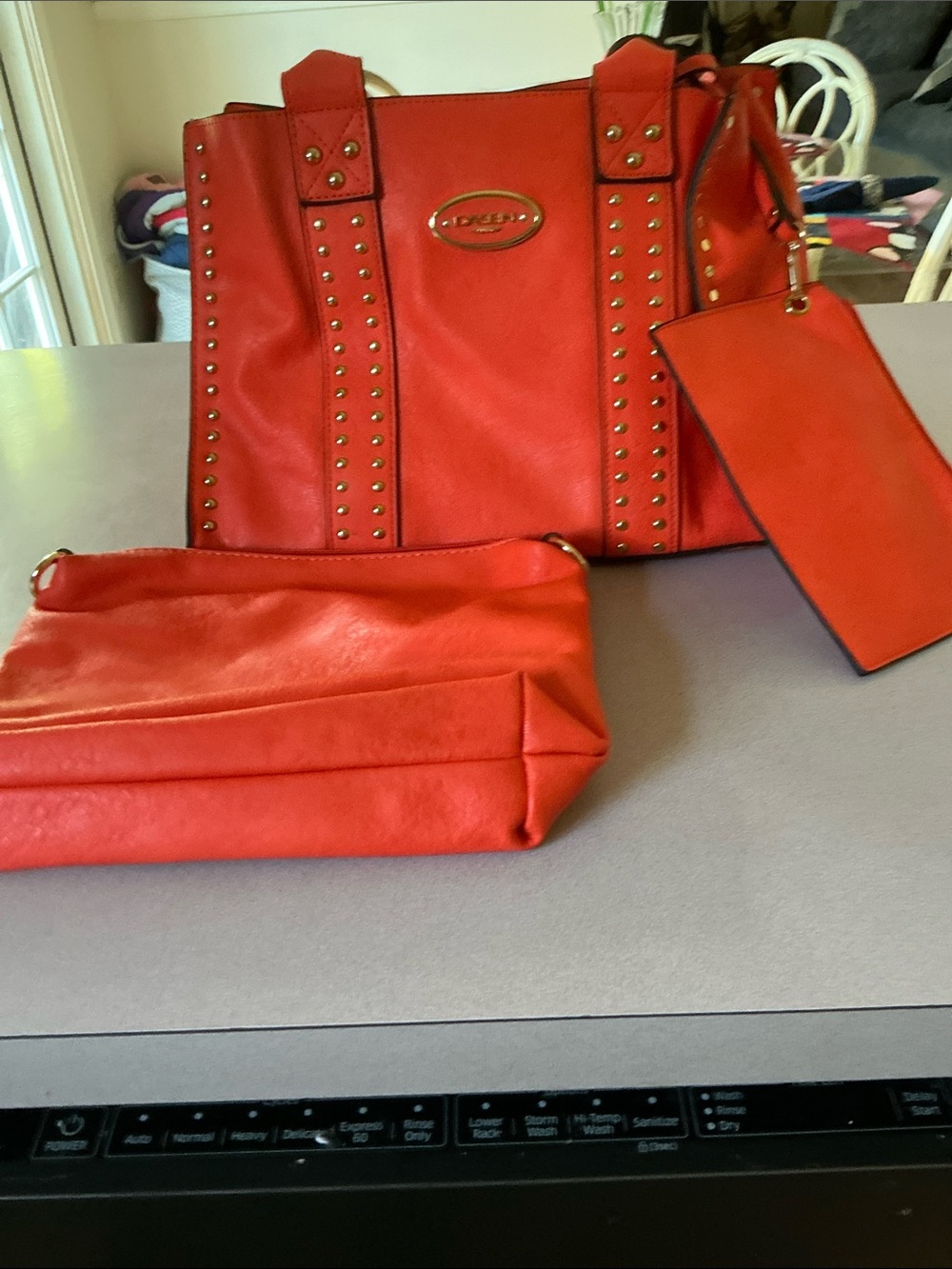 CUTE!!  Dasein orange bag with gold studs 3 piece bag set,, makeup and coin .